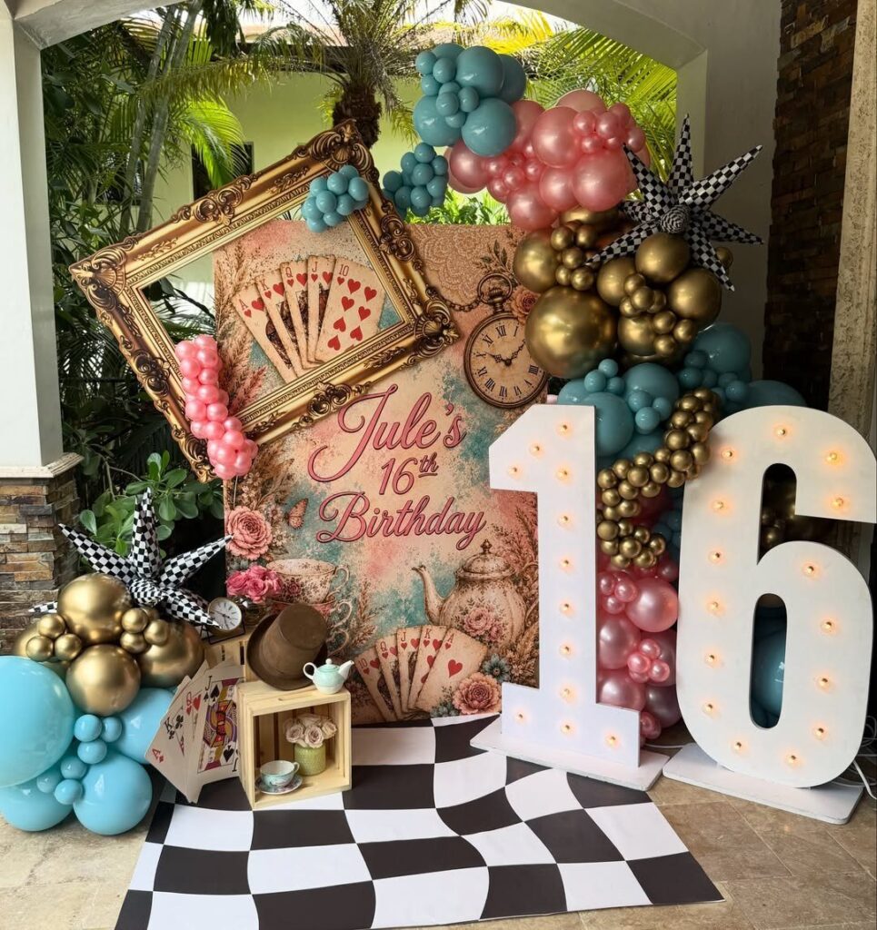Alice in Wonderland themed 16th birthday backdrop with balloons and checkered floor